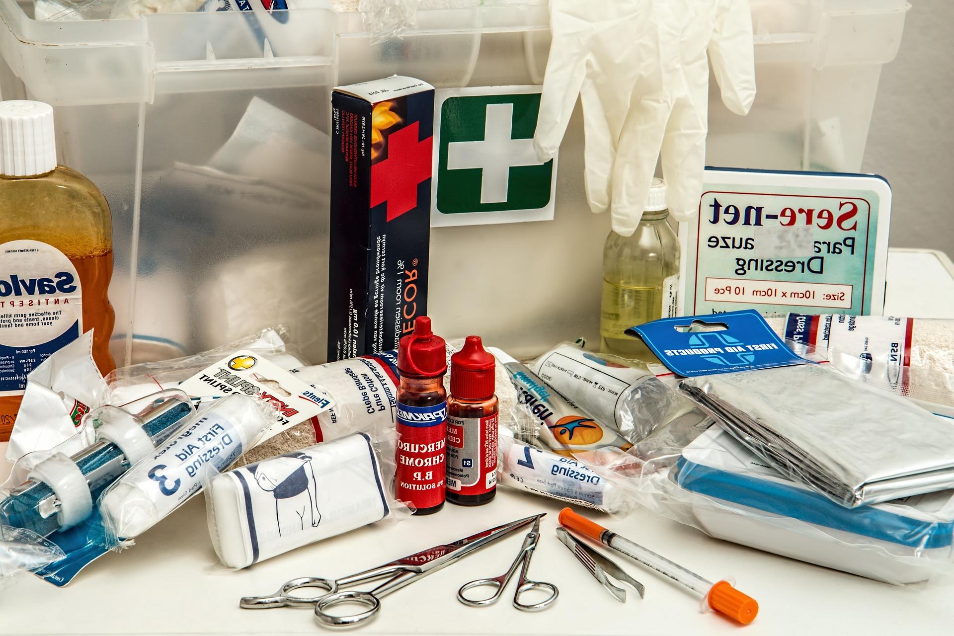 A variety of first-aid supplies laid out on a table